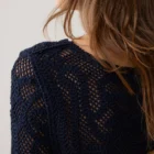 Fitted short jumper made of 100% cotton in a macramé look. Pairs well with a camisole or bralette underneath. Washing advice: we recommend washing this item in a laundry bag.
