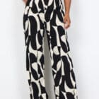 Description EN: SC-CHANISE 3-B are elegant pants crafted from 100% LENZING™ ECOVERO™ Viscose. These pants showcase a stylish abstract print and a comfortable drawstring waistband, with a full length. Pair these unique pants with a plain top and sandals for a cool, relaxed look.