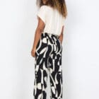 Description EN: SC-CHANISE 3-B are elegant pants crafted from 100% LENZING™ ECOVERO™ Viscose. These pants showcase a stylish abstract print and a comfortable drawstring waistband, with a full length. Pair these unique pants with a plain top and sandals for a cool, relaxed look.