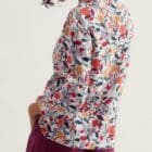 A pretty, relaxed top with feminine details, made from soft and breathable cotton. The notch neck has a functioning singular button and a subtle crossover design, while the dropped hem has curved edges that look great worn loose over trousers. Just add a pair of easy trainers for effortless everyday style. Main Garment:100% Cotton (organic) Relaxed fit Notch neckline Button fastening Certified organic to Global Organic Textile Standards (GOTS) by Soil Association Certification GOTS-11394 Machine Wash 30C