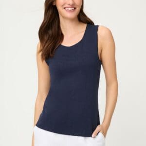 This deep navy blue top is a versatile base for summer outfits. It features a fitted cut, a round neckline, and is sleeveless. The smooth cotton fabric feels comfortable against the skin and works well with everyday outfits as well as under a blazer or cardigan. It pairs perfectly with linen trousers, midi skirts, and denim. Length: 60 cm Composition: 100% cotton Article number: 11105362