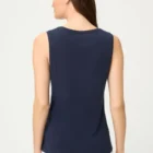 This deep navy blue top is a versatile base for summer outfits. It features a fitted cut, a round neckline, and is sleeveless. The smooth cotton fabric feels comfortable against the skin and works well with everyday outfits as well as under a blazer or cardigan. It pairs perfectly with linen trousers, midi skirts, and denim. Length: 60 cm Composition: 100% cotton Article number: 11105362